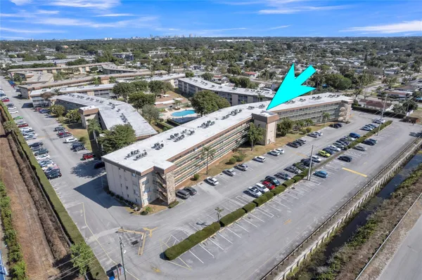 an aerial view of a house with a swimming pool