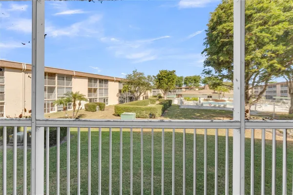 an empty room with a kitchen