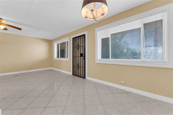 a view of hallway with a chandelier
