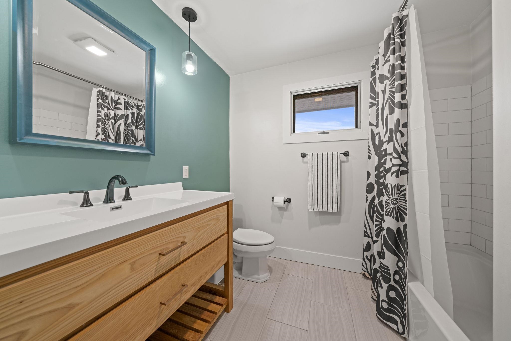 804 Jackson Street Oregon, IL 61061 - Photo 14 of 44 a bathroom with a sink a toilet and a mirror