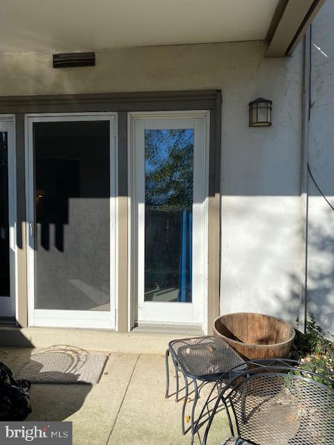 103 Cross Keys Road, Unit R103A Baltimore, MD 21210 - Photo 11 of 13 Patio door leads to The main room
