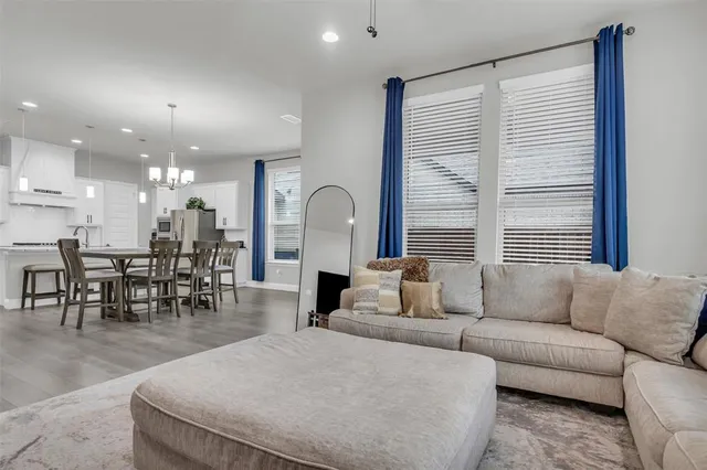 a living room with furniture fireplace and flat screen tv