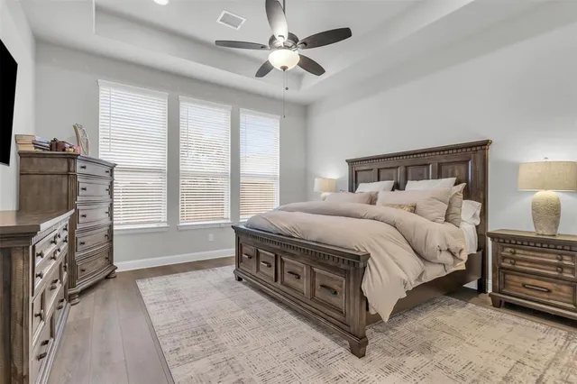 a bed room with a bed and a night stand