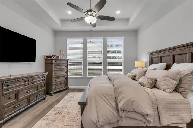 a large kitchen with granite countertop a sink and a refrigerator