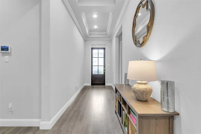 a view of room with window and wooden floor