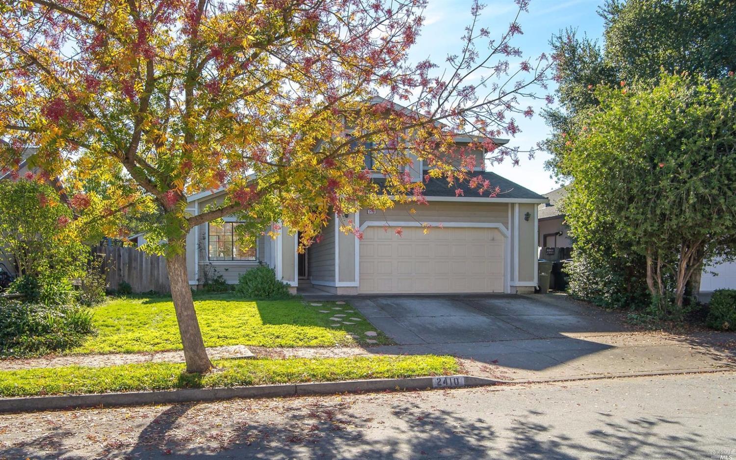 2410 Button Court Santa Rosa, CA 95403 - Photo 1 of 1 a front view of house with yard and garage