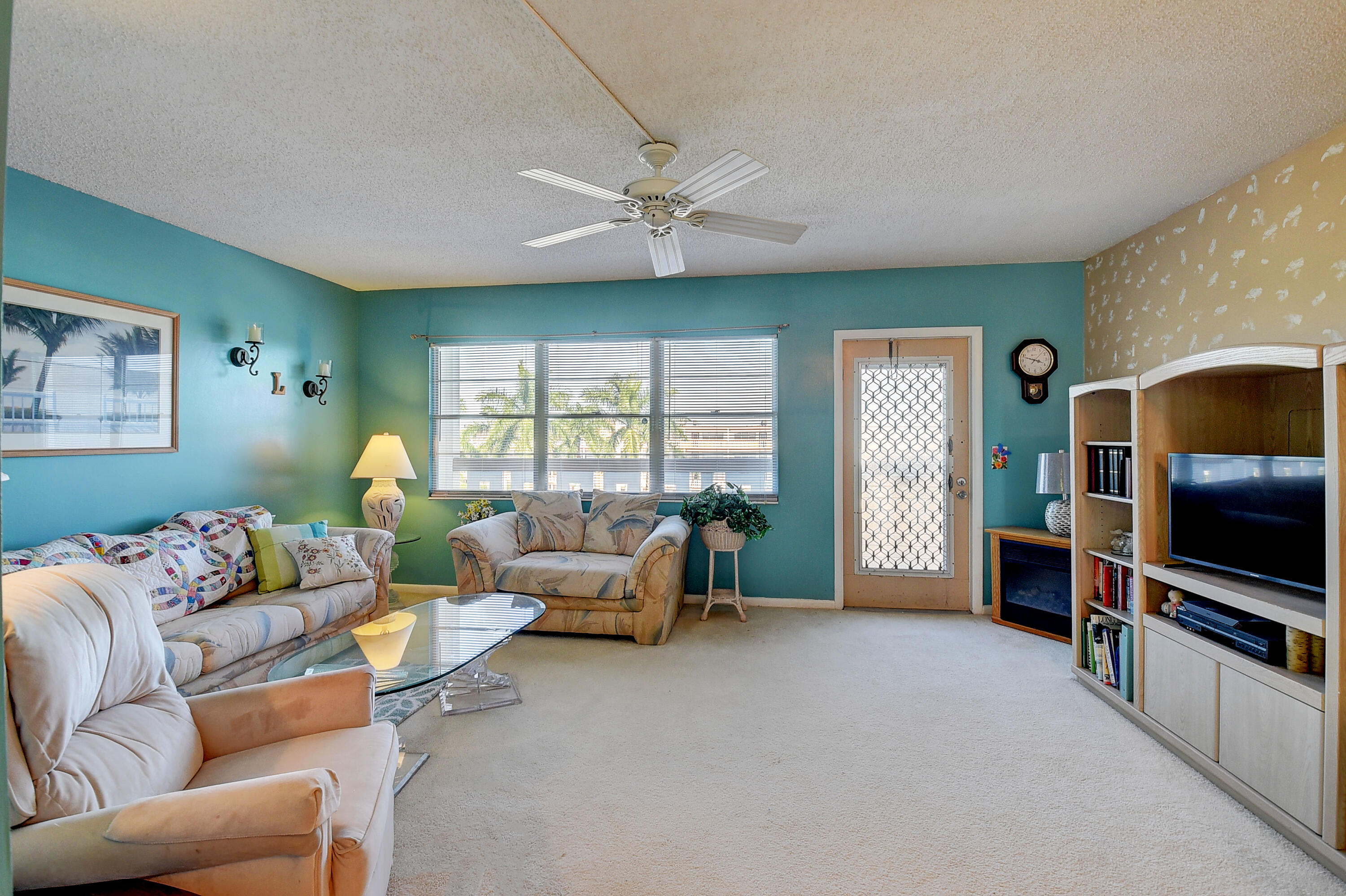 4089 Cornwall East Boca Raton, FL 33434 - Photo 3 of 35 a living room with furniture and a flat screen tv