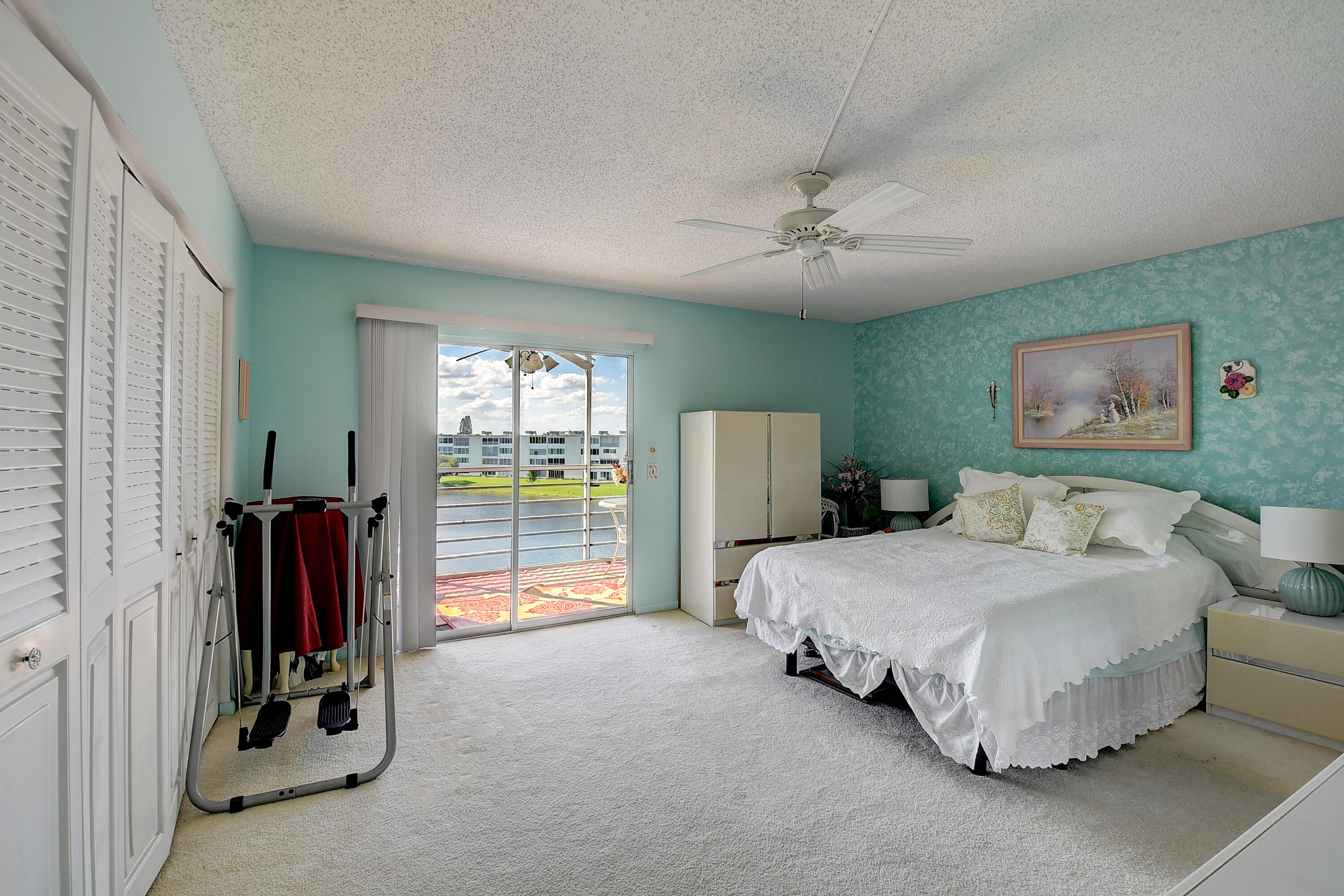 4089 Cornwall East Boca Raton, FL 33434 - Photo 10 of 35 a bedroom with a bed and a large walk in closet
