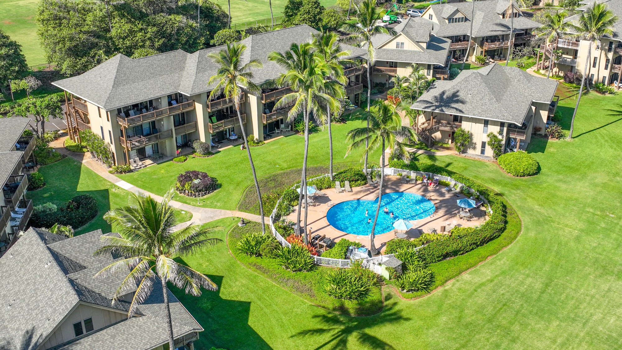 4460 Nehe Road, Unit 116 Lihue, HI 96766 - Photo 22 of 28 an aerial view of a house with a garden and lake view