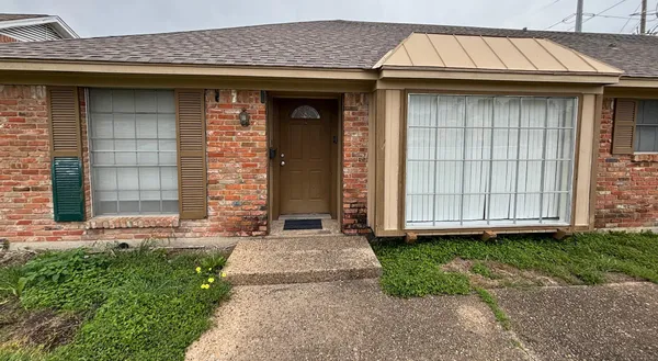 a view of a house with small yard