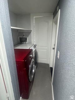 8155 South Redwood Road, Unit 96 West Jordan, UT 84088 - Photo 16 of 17 Laundry room featuring a textured wall and washing machine and clothes dryer