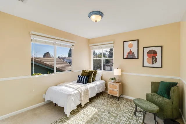 a bedroom with a bed and window