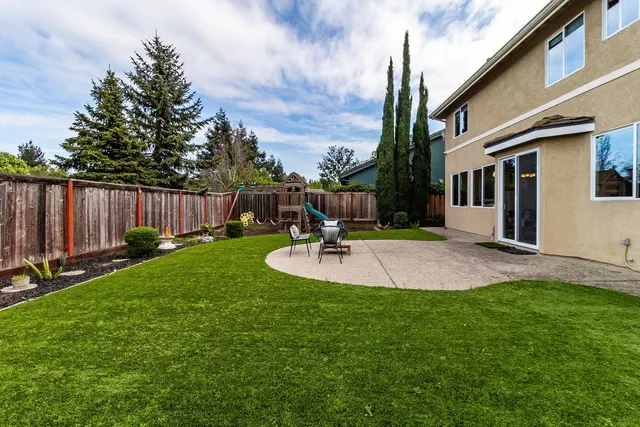 a garden with wooden fence