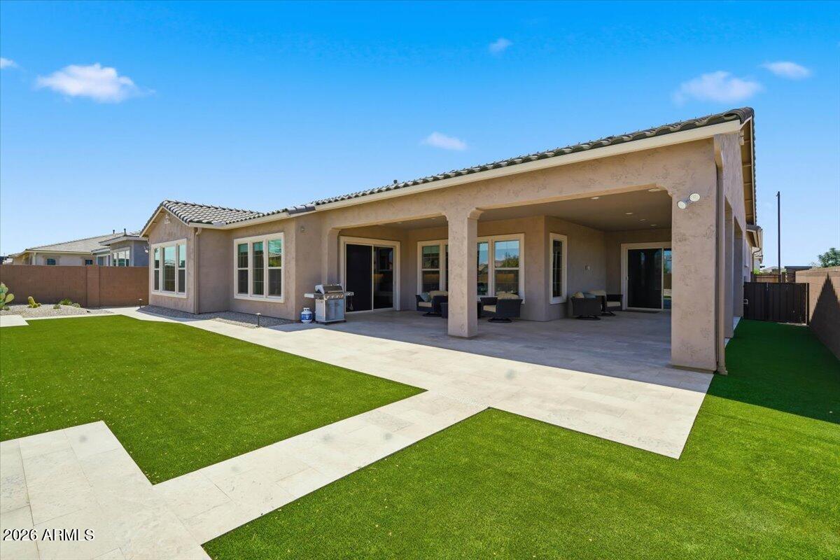 22608 East Stacey Road Queen Creek, AZ 85142 - Photo 58 of 83 a view of a house with a backyard porch and sitting area
