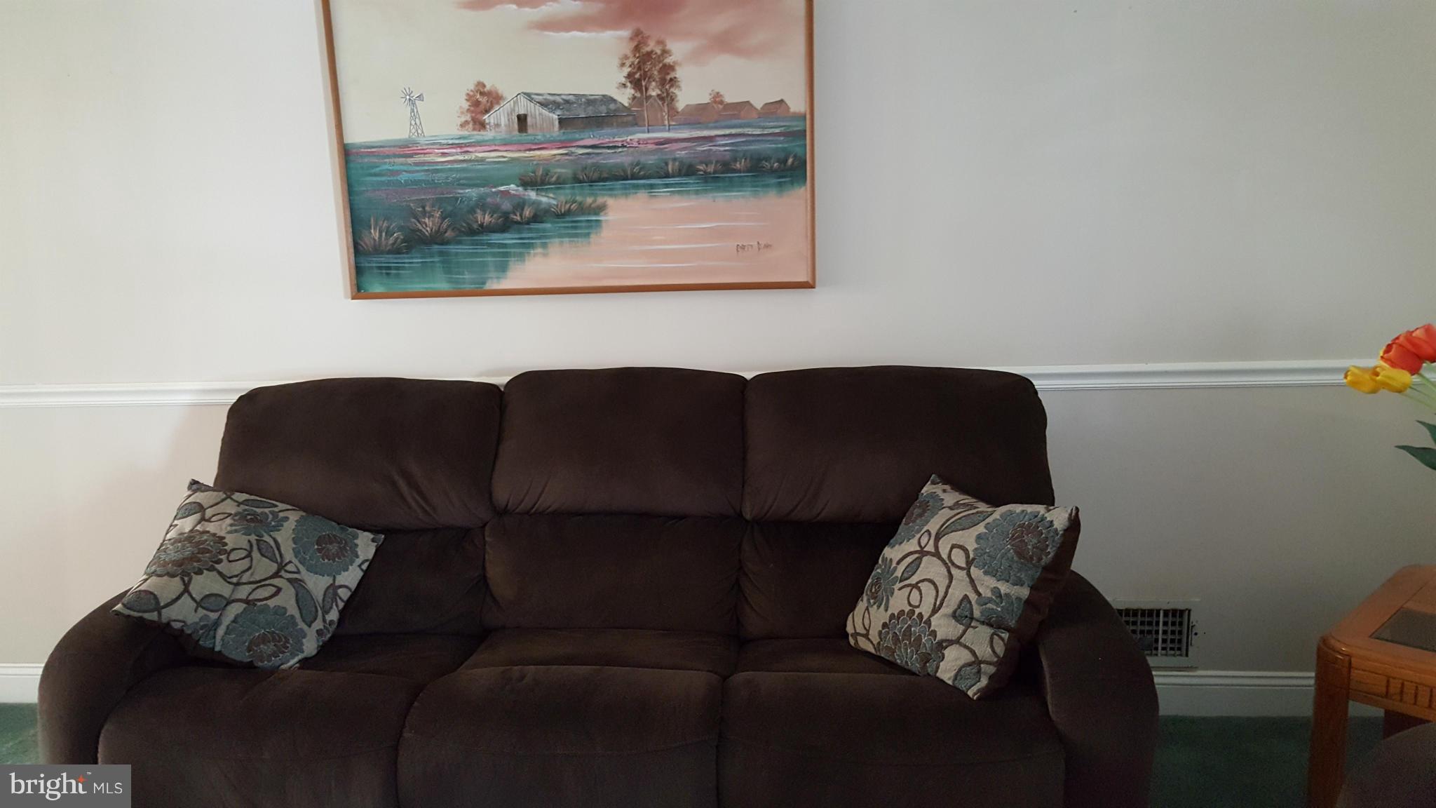 1943 Jasmine Road Baltimore, MD 21222 - Photo 8 of 29 a living room with furniture and a window