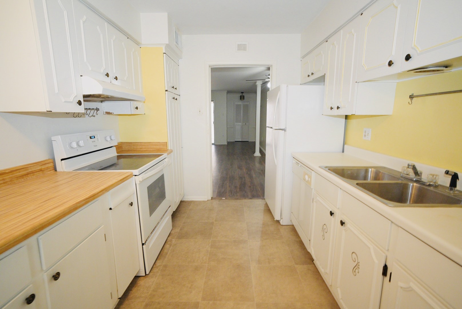 7600 Burgoyne Road, Unit 250 Houston, TX 77063 - Photo 14 of 14 This inviting hallway features sleek hardwood floors and ample natural light, creating a warm and welcoming path to your home's private spaces.