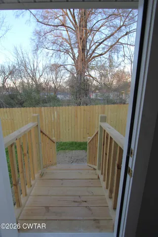 a view of deck with wooden floor and lake view