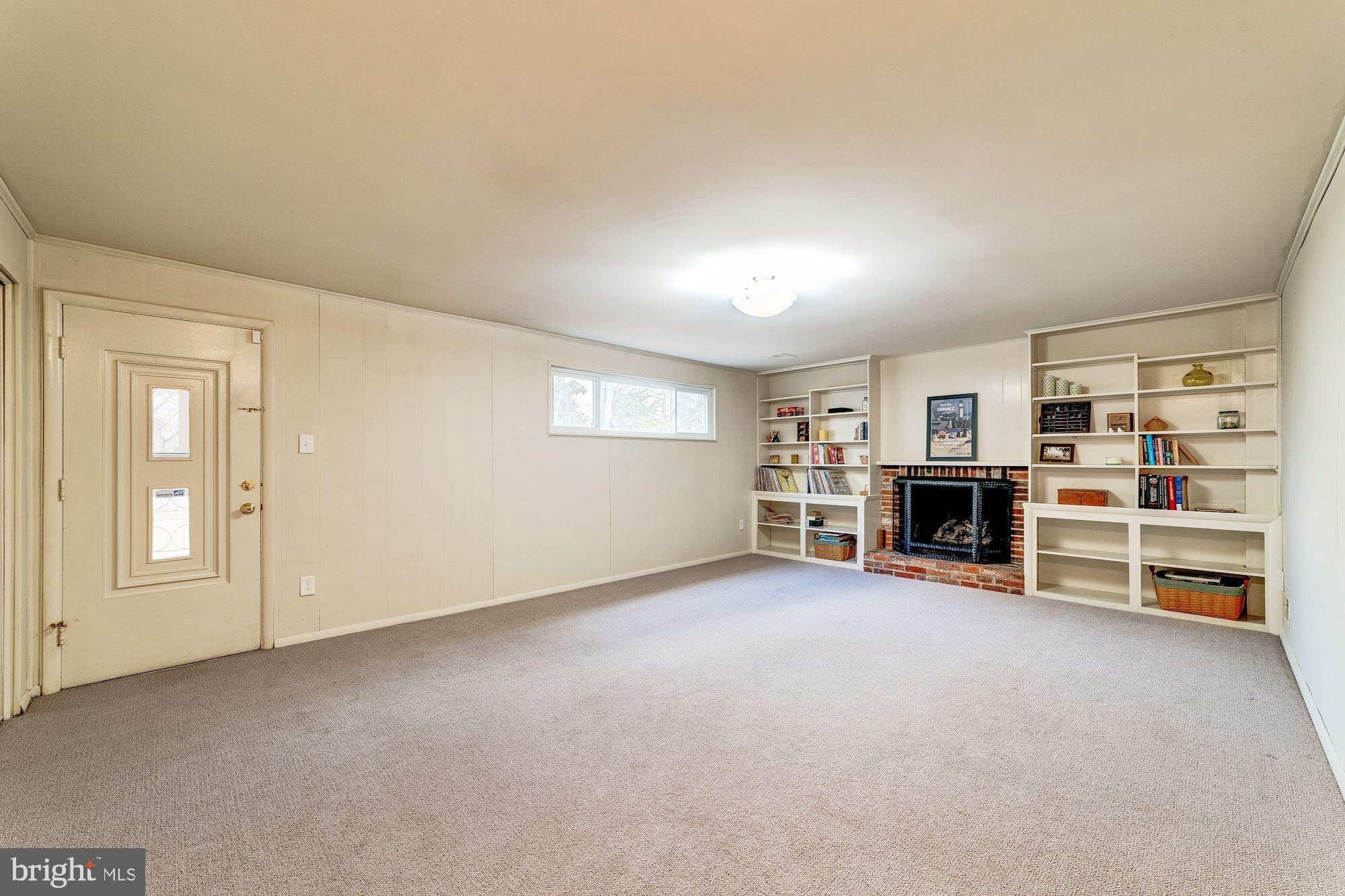8403 Wagon Wheel Road Alexandria, VA 22309 - Photo 25 of 47 Family Rm w/ cozy fireplace and walk out to porch