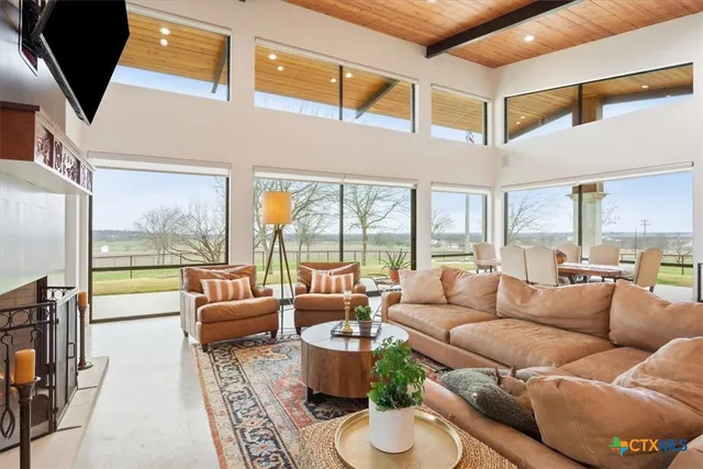 a view of a patio with table and chairs and potted plants