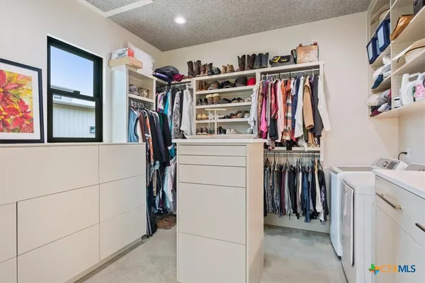 a bathroom with a sink mirror and vanity