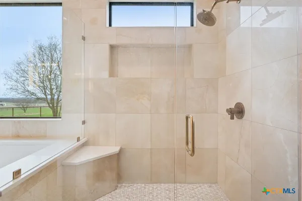 a bathroom with a bathtub and a sink