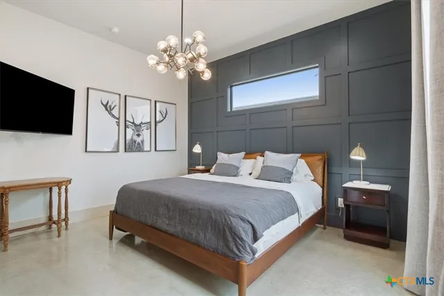 a view of a patio with a table and chairs and potted plants