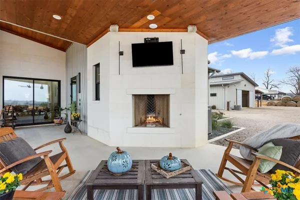 a view of a house with a backyard and garage