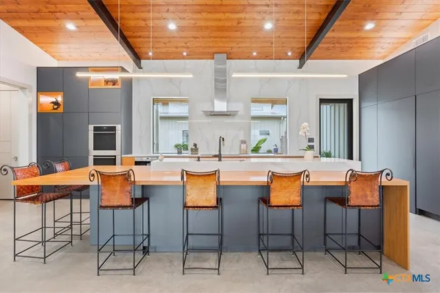 a bedroom with a large bed and a large window