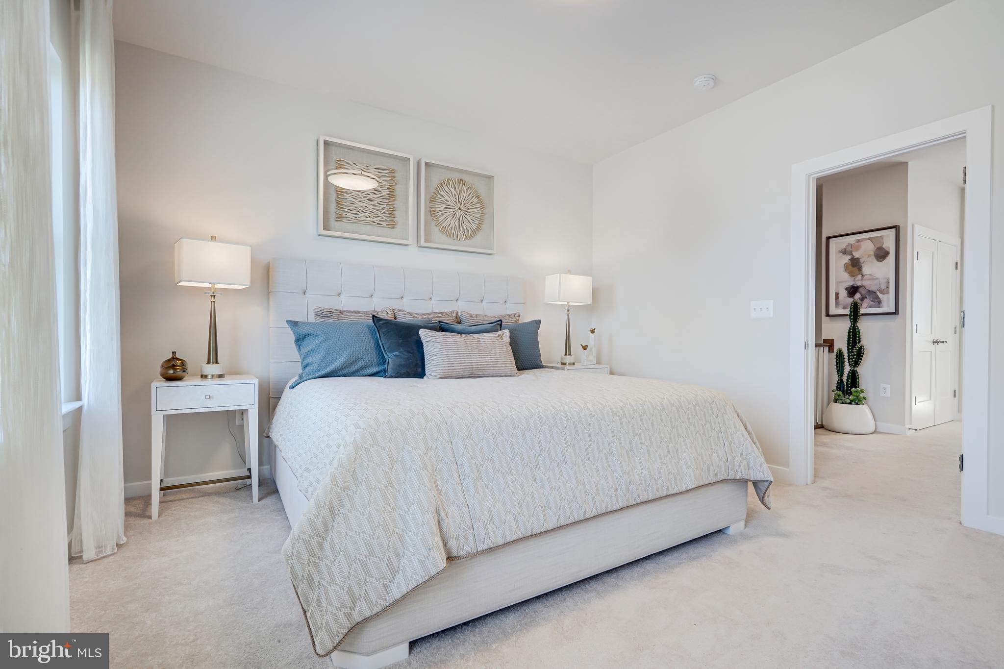 13672 Cobble Loop Woodbridge, VA 22193 - Photo 27 of 47 a bedroom with a bed and a night stand