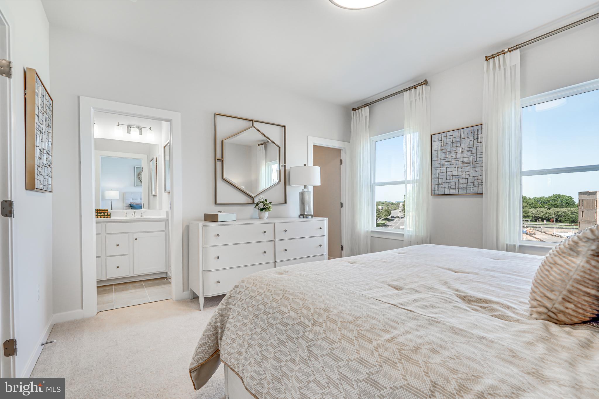 13672 Cobble Loop Woodbridge, VA 22193 - Photo 30 of 47 a bedroom with a bed a mirror and a dresser