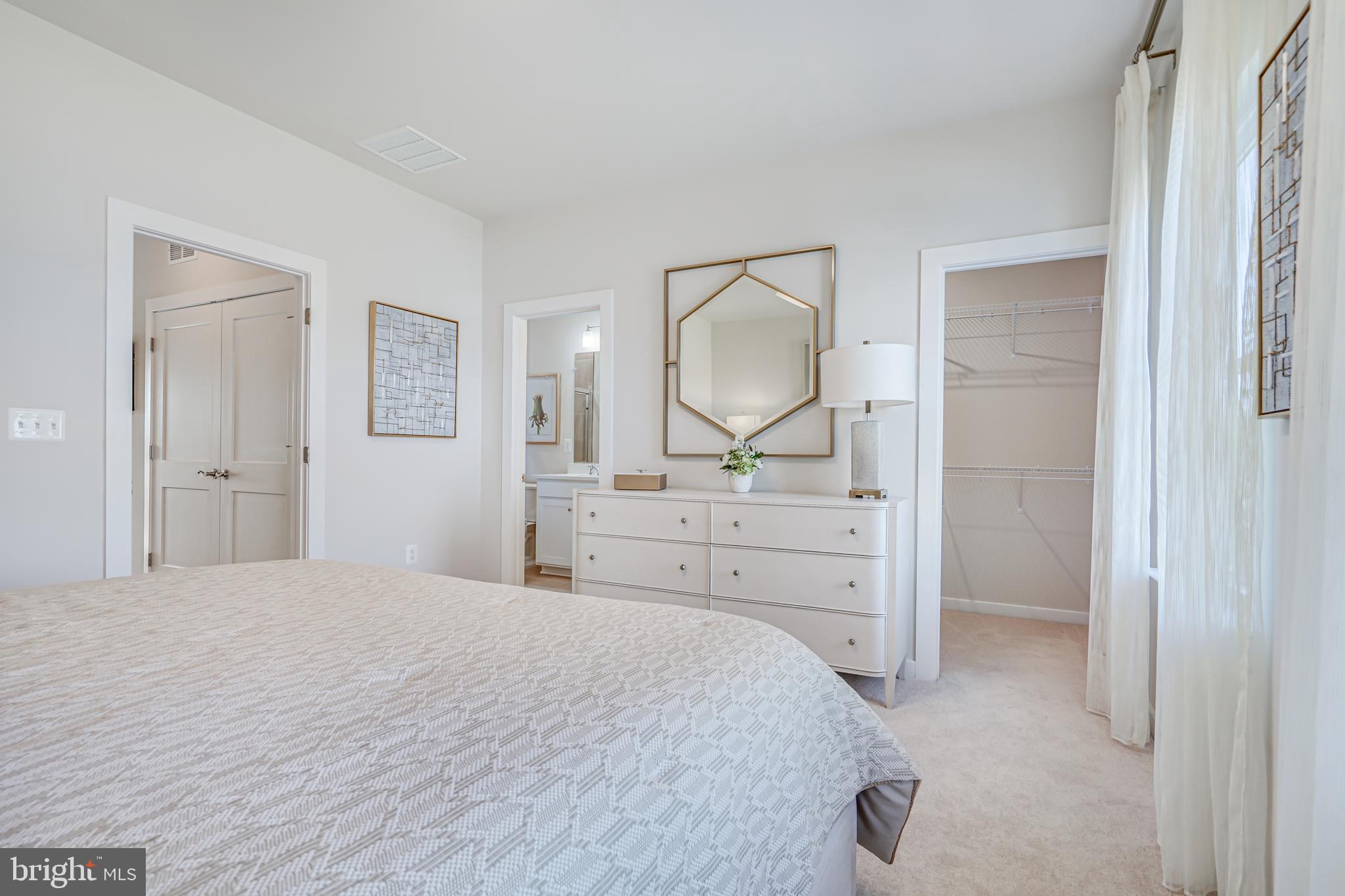 13672 Cobble Loop Woodbridge, VA 22193 - Photo 31 of 47 a bedroom with a bed and a dresser