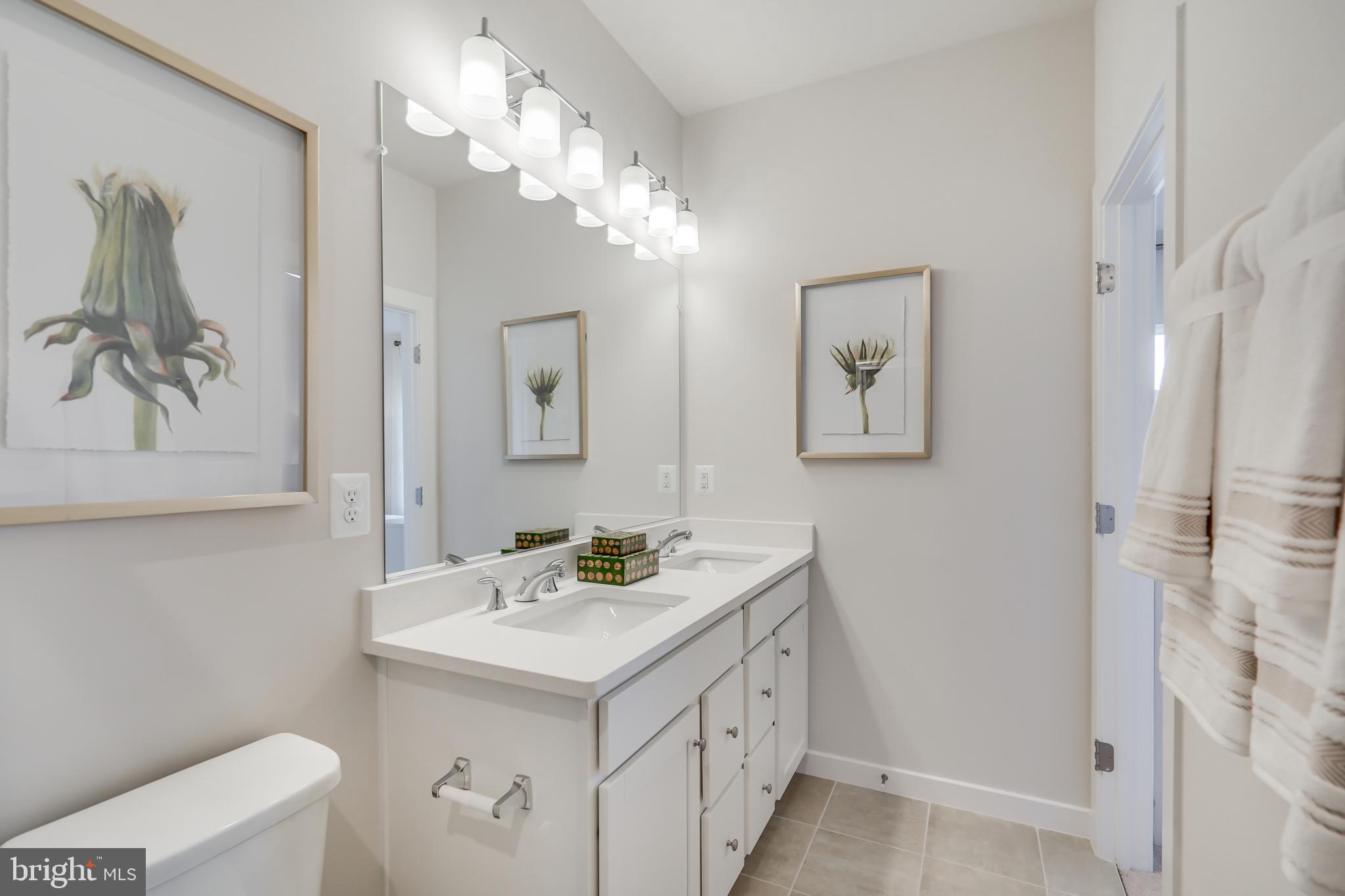 13672 Cobble Loop Woodbridge, VA 22193 - Photo 33 of 47 a bathroom with a sink a toilet and a mirror