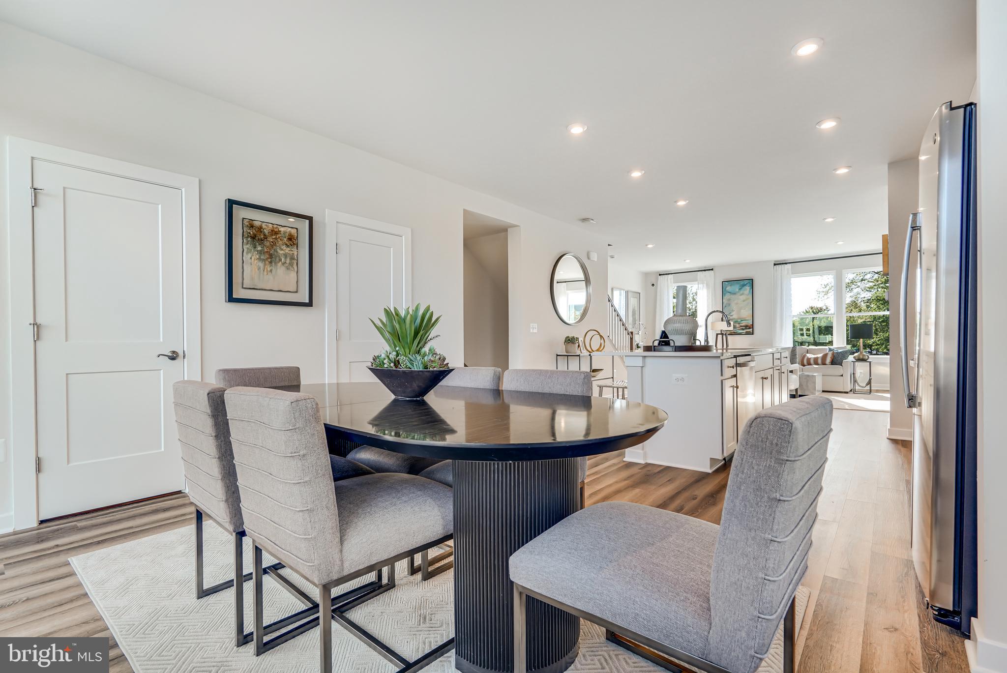 13672 Cobble Loop Woodbridge, VA 22193 - Photo 8 of 47 a view of a dining room with furniture and a potted plant