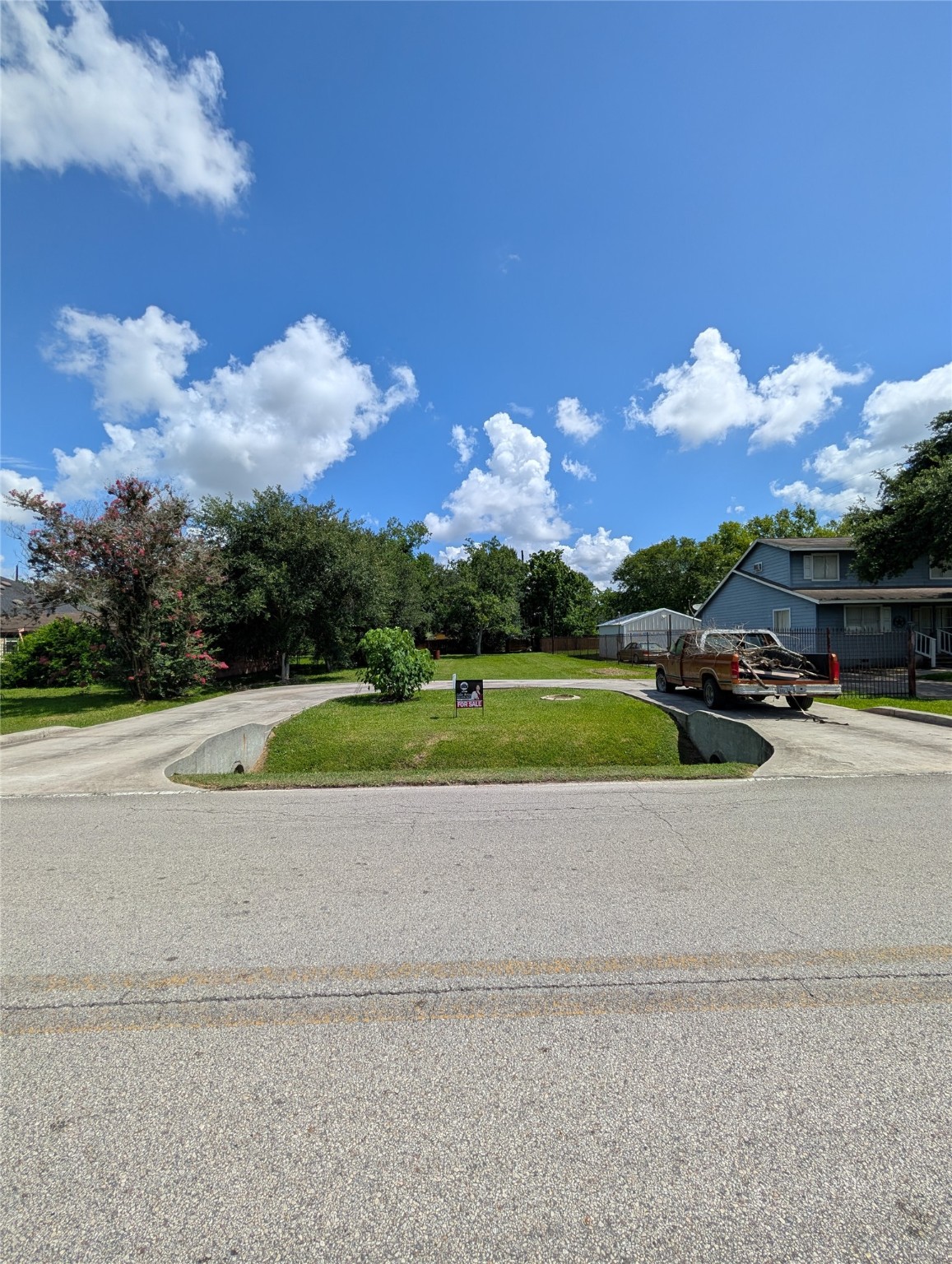 a view of a golf course with a road