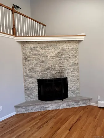 a view of a fireplace with wooden floor