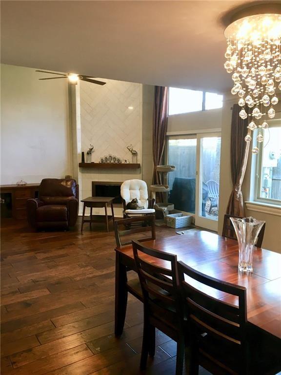 6441 Cedar Hollow Dallas, TX 75248 - Photo 3 of 7 a view of a dining room with furniture window and wooden floor