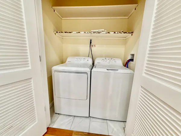 a utility room with dryer and washer