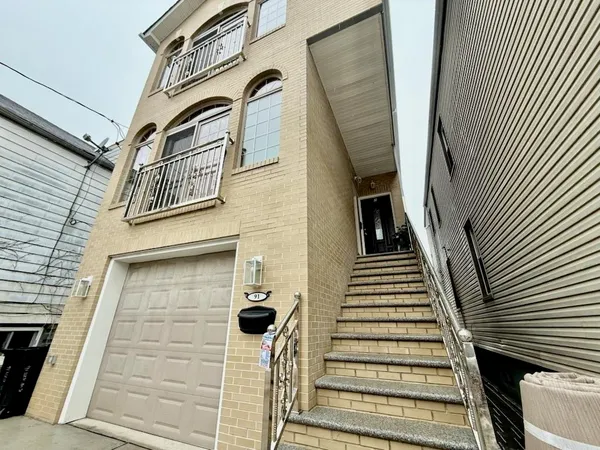 a view of a balcony with stairs and wooden floor