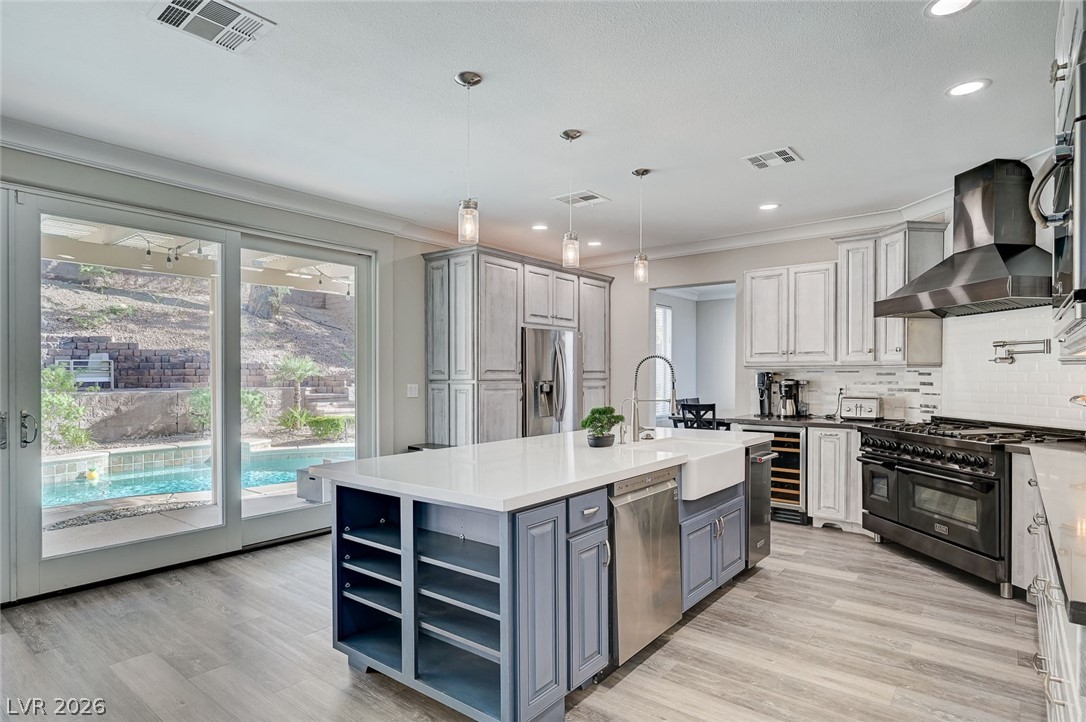2391 Rainswept Avenue Henderson, NV 89052 - Photo 4 of 62 This kitchen offers a spacious layout with direct access to a refreshing pool, ideal for everyday living.