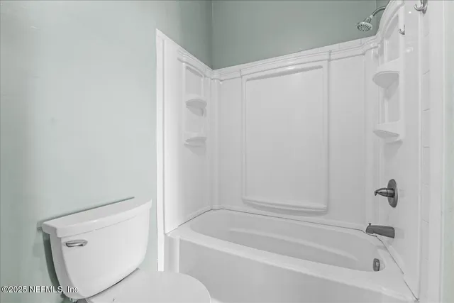 a bathroom with a shower and a bathtub