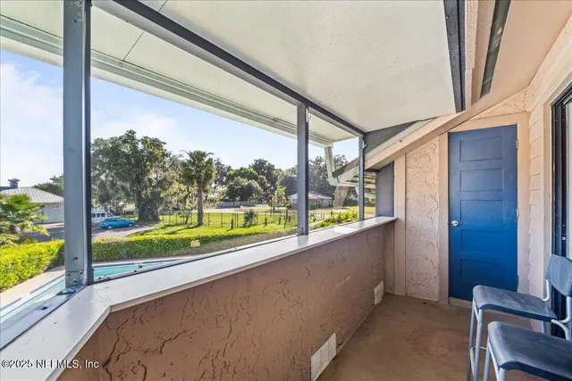 a view of chairs and tables in the patio