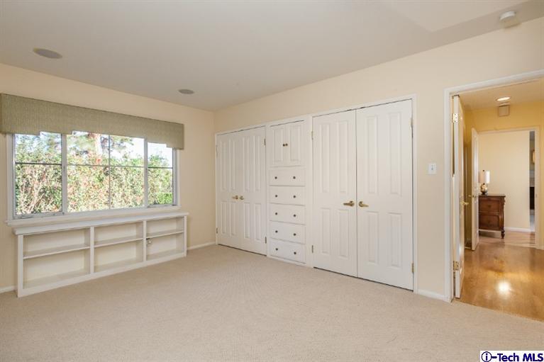 1700 Devon Road Pasadena, CA 91103 - Photo 16 of 28 an empty room with windows and closet