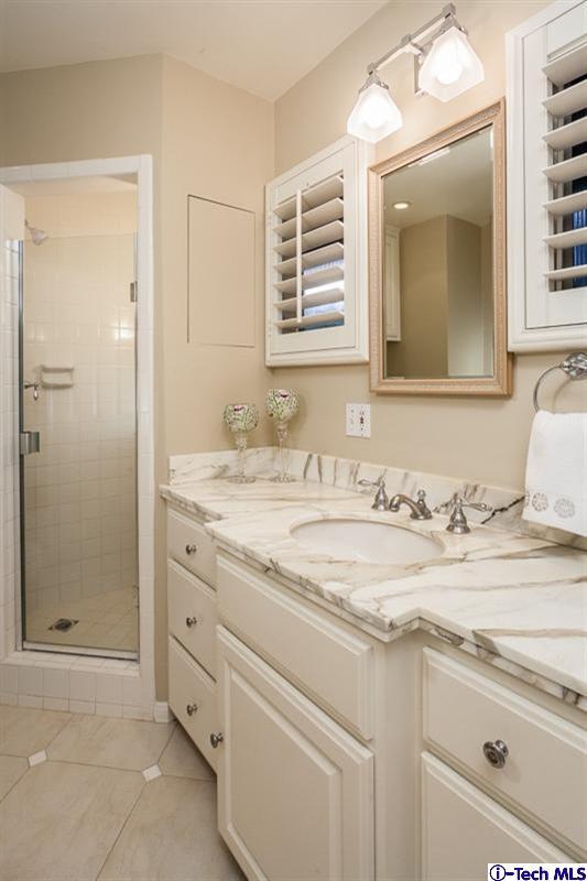 1700 Devon Road Pasadena, CA 91103 - Photo 17 of 28 a bathroom with a granite countertop sink mirror and double