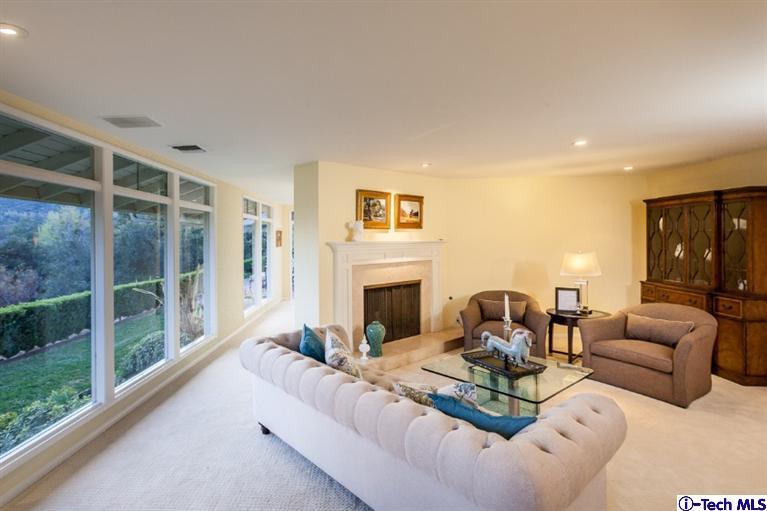 1700 Devon Road Pasadena, CA 91103 - Photo 5 of 28 a living room with furniture large window and fireplace