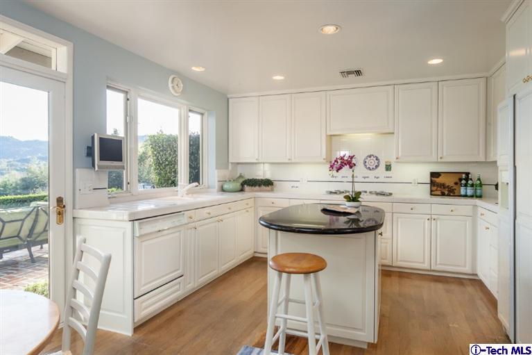 1700 Devon Road Pasadena, CA 91103 - Photo 10 of 28 a kitchen with a sink and cabinets