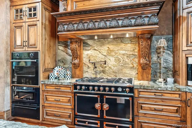 a balcony with wooden floor table and chairs