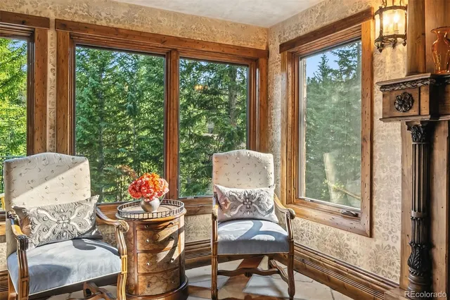 a bed room with a bed and a large window