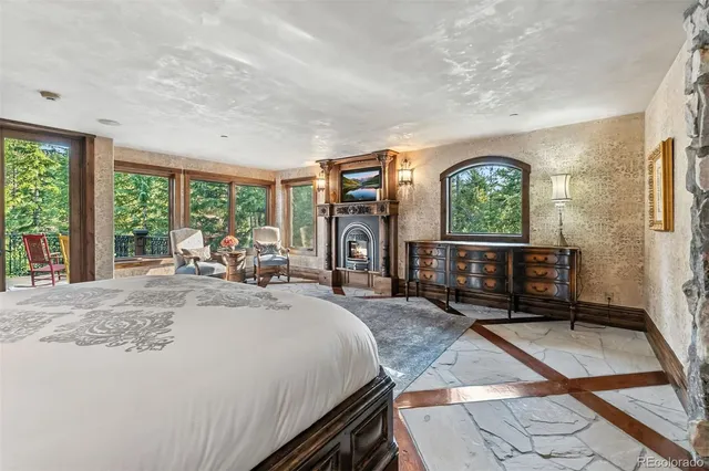 a living room with a couch and a dresser next to a window