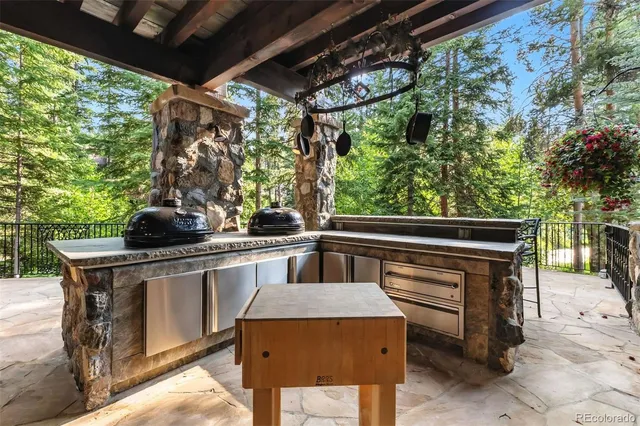 a view of a chairs and table in the balcony