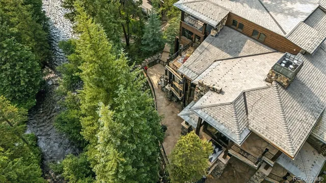 a view of a patio with iron fence